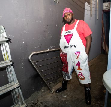 Man stands in a backstage area