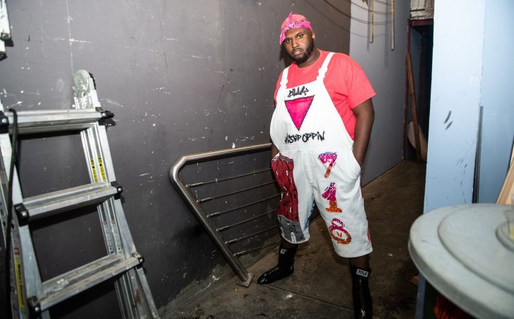 Man stands in a backstage area