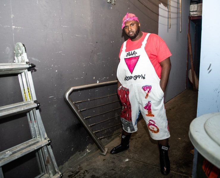 Man stands in a backstage area