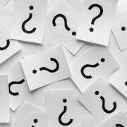 Background texture of printed question marks