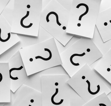 Background texture of printed question marks