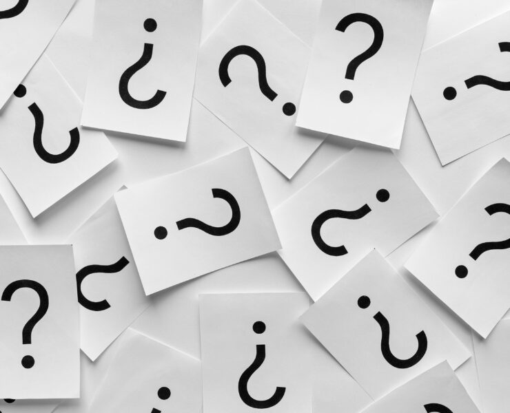 Background texture of printed question marks